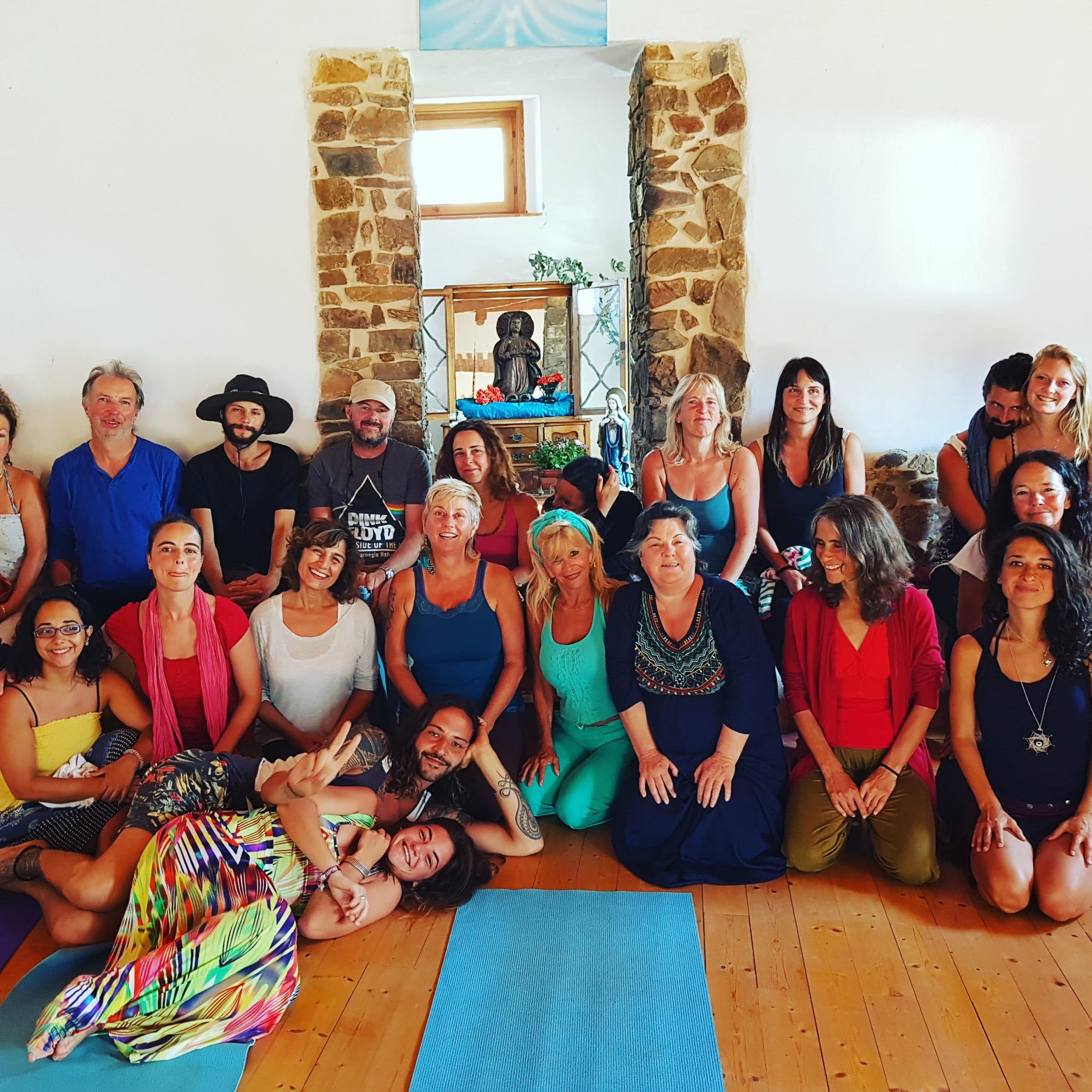 A group of people stood together smiling at one of the firehorse healing events