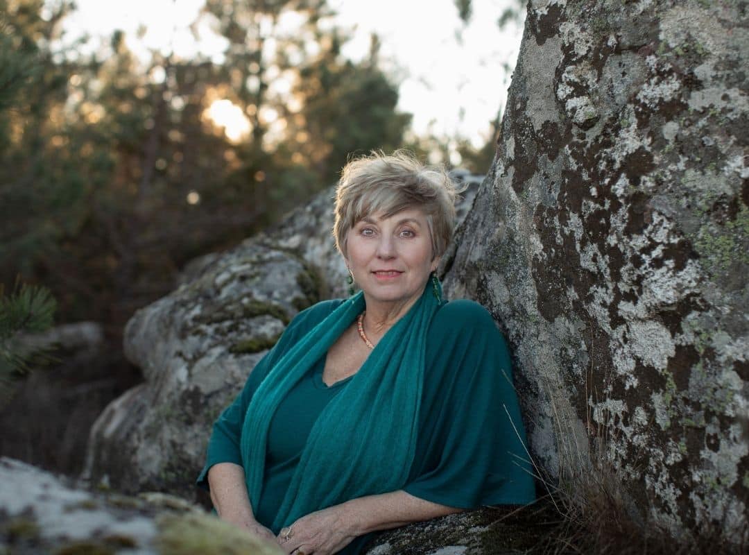 Shaman Sue Holmes completing a session, smiling into the distance